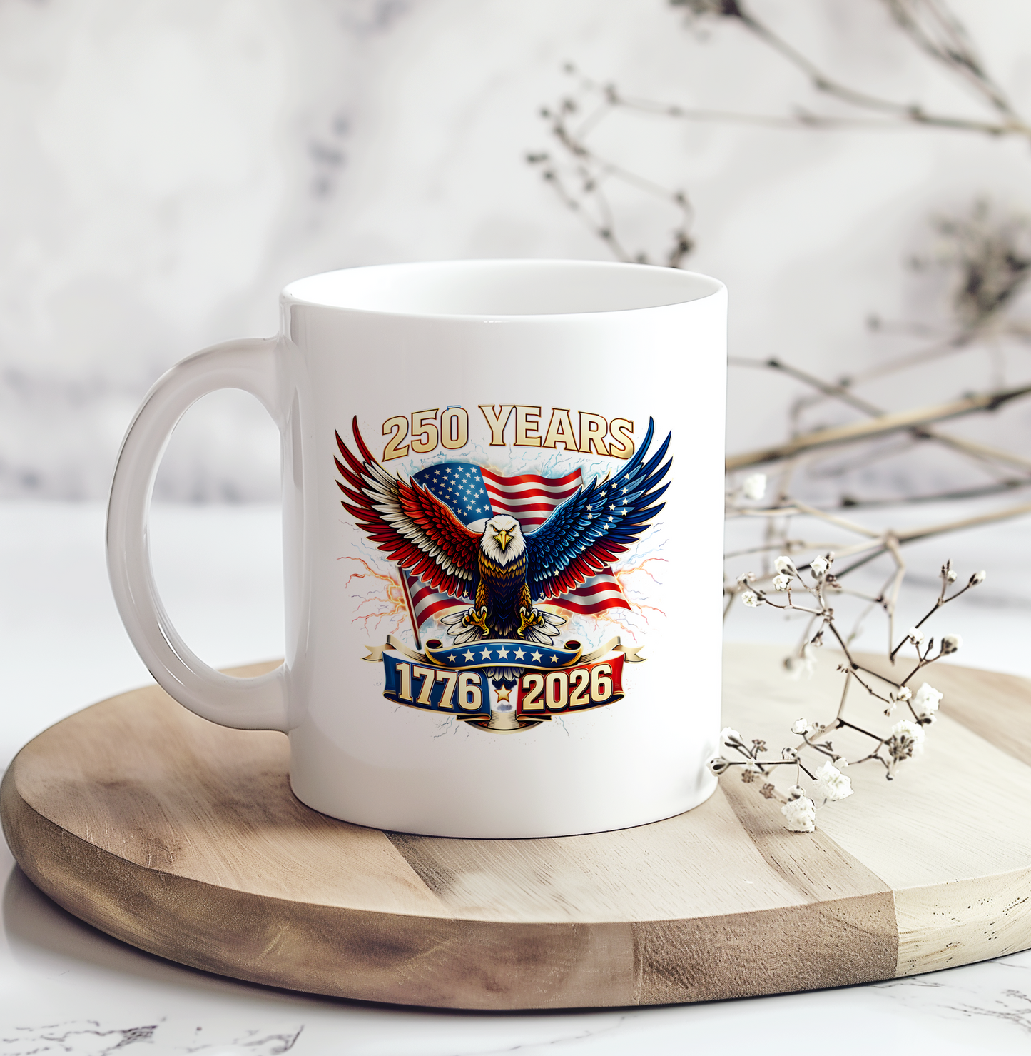 White ceramic coffee mug featuring a patriotic bald eagle with American flag artwork and "250 Years 1776–2026" design celebrating America's 250th anniversary.