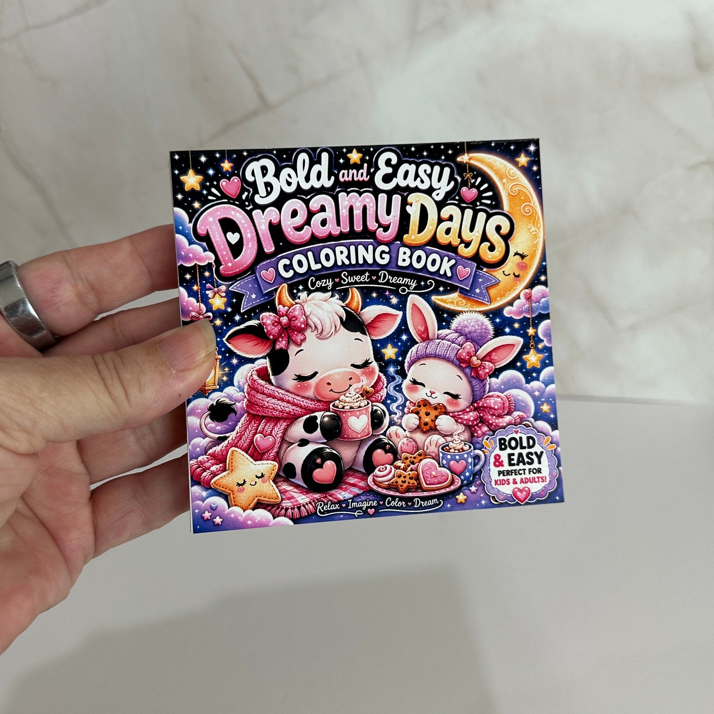 Mini coloring book featuring a cozy cow and bunny under a crescent moon with bold, easy coloring pages for kids, teens, and adults.