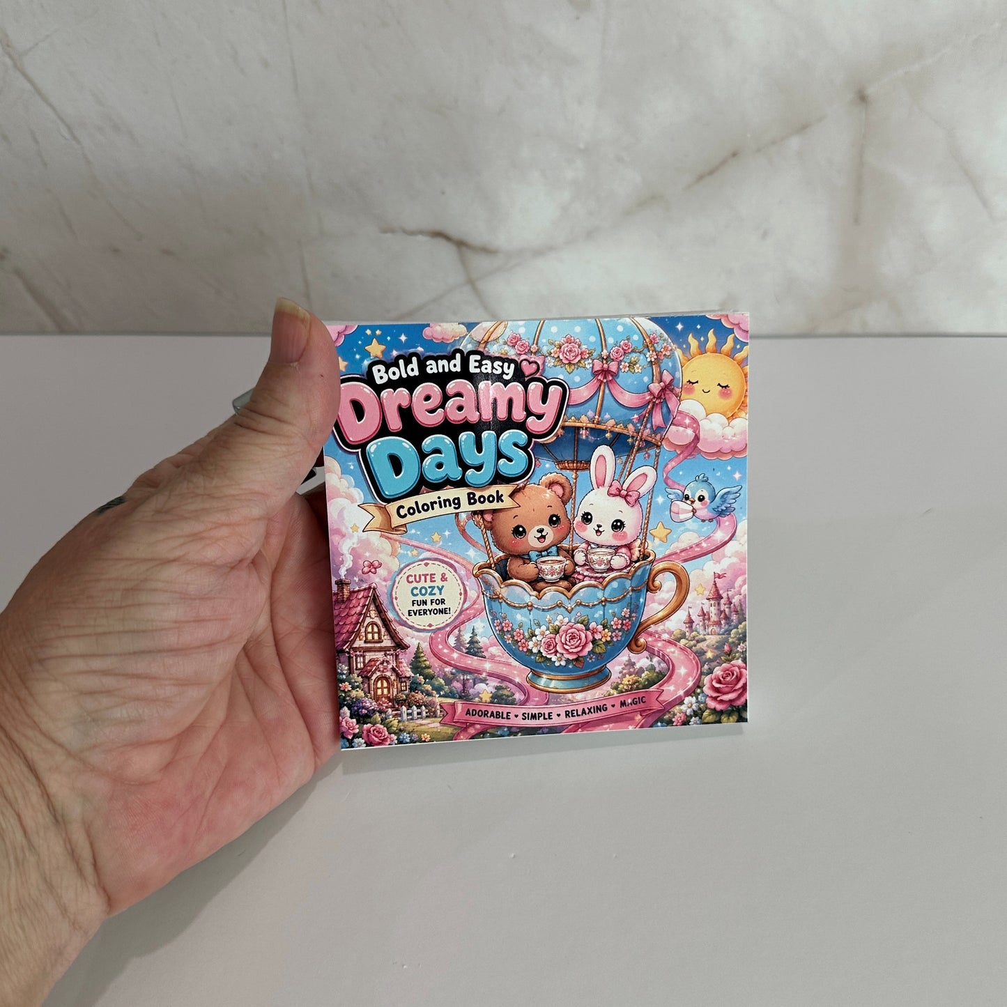 Bold and Easy Dreamy Days mini coloring book featuring adorable bear and bunny in a teacup with cute fantasy illustrations and bold easy coloring pages.