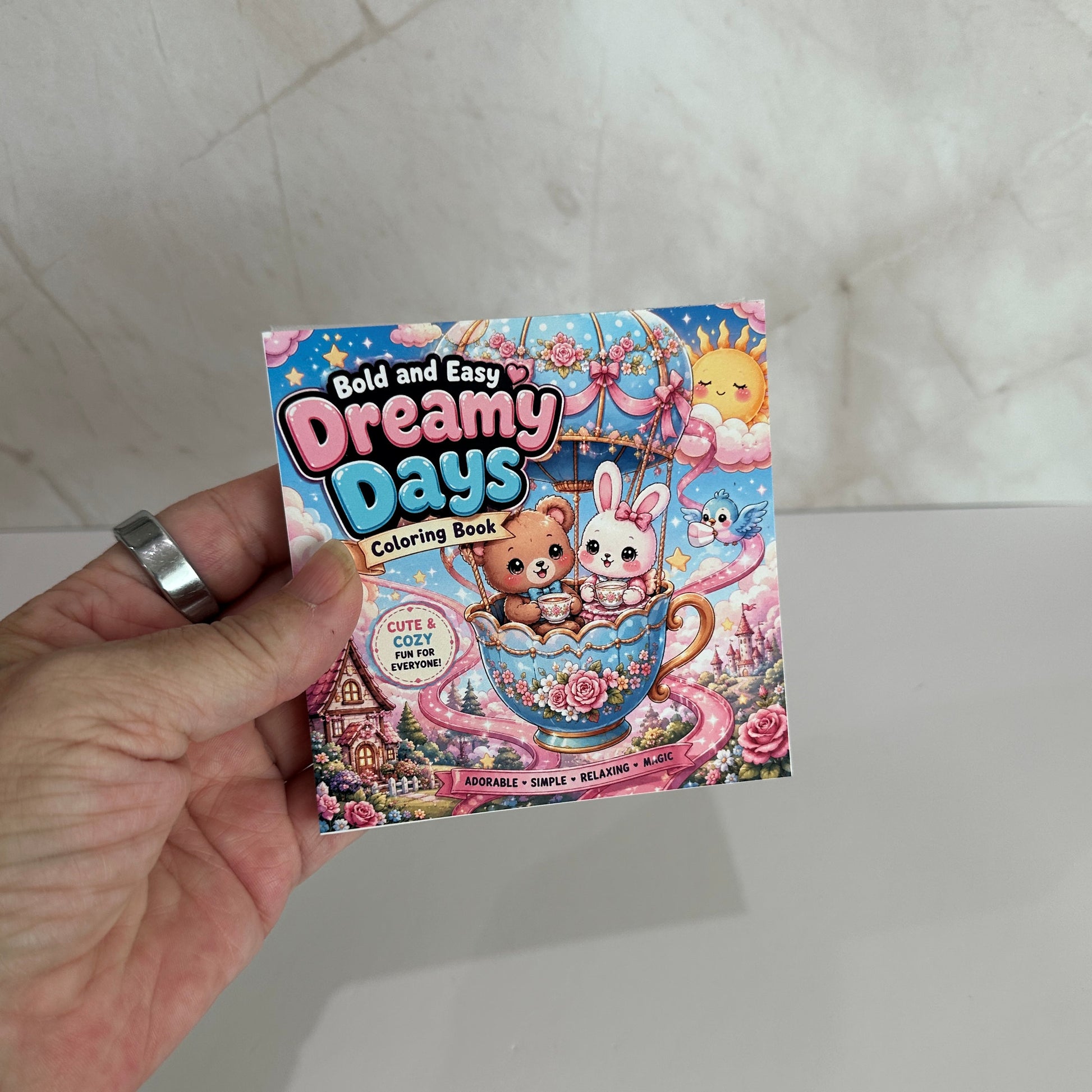 Bold and Easy Dreamy Days mini coloring book featuring adorable bear and bunny in a teacup with cute fantasy illustrations and bold easy coloring pages.
