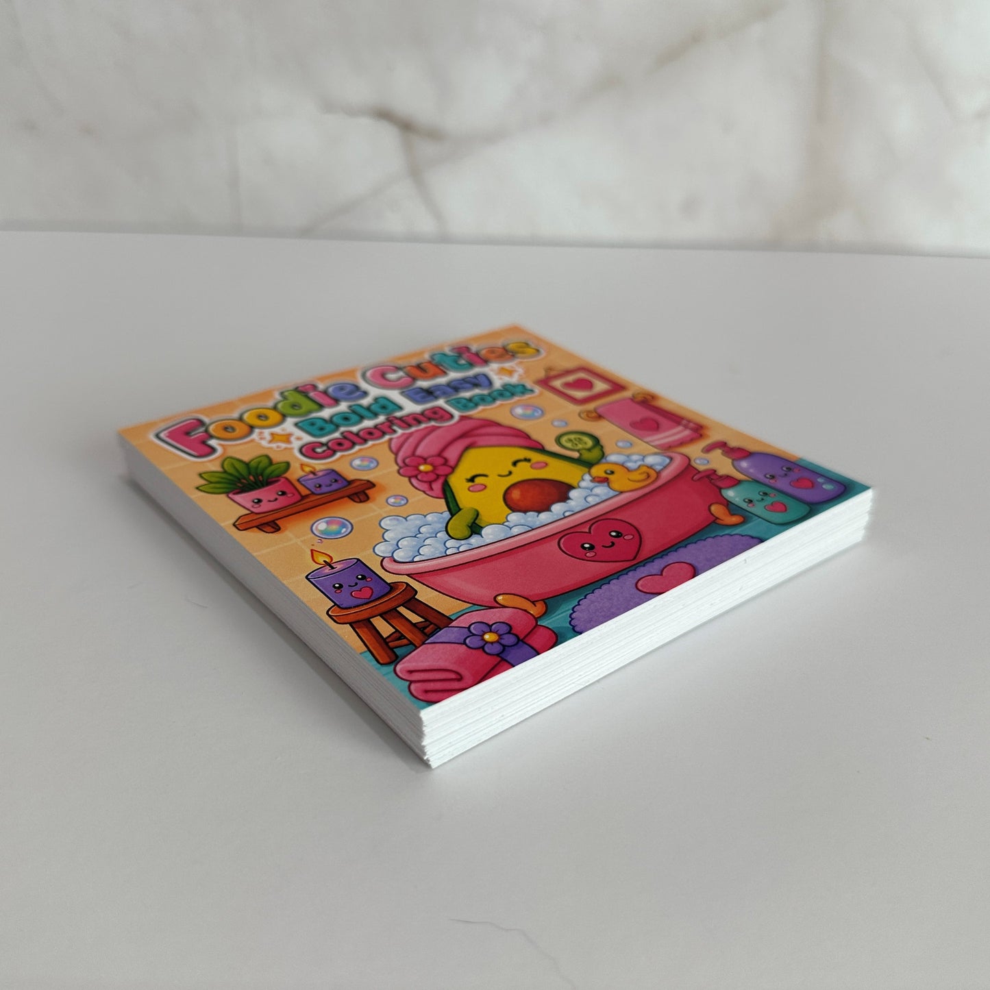 Foodie Cuties Bold Easy mini coloring book featuring a kawaii avocado relaxing in a bubble bath with spa accessories.