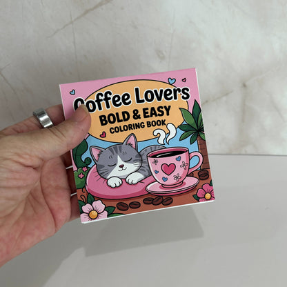 Coffee Lovers Bold and Easy Mini Coloring Book featuring cute sleeping kitten beside a pink coffee cup with cozy café themed illustrations.