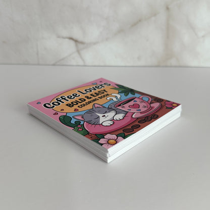 Coffee Lovers Bold and Easy Mini Coloring Book featuring cute sleeping kitten beside a pink coffee cup with cozy café themed illustrations.