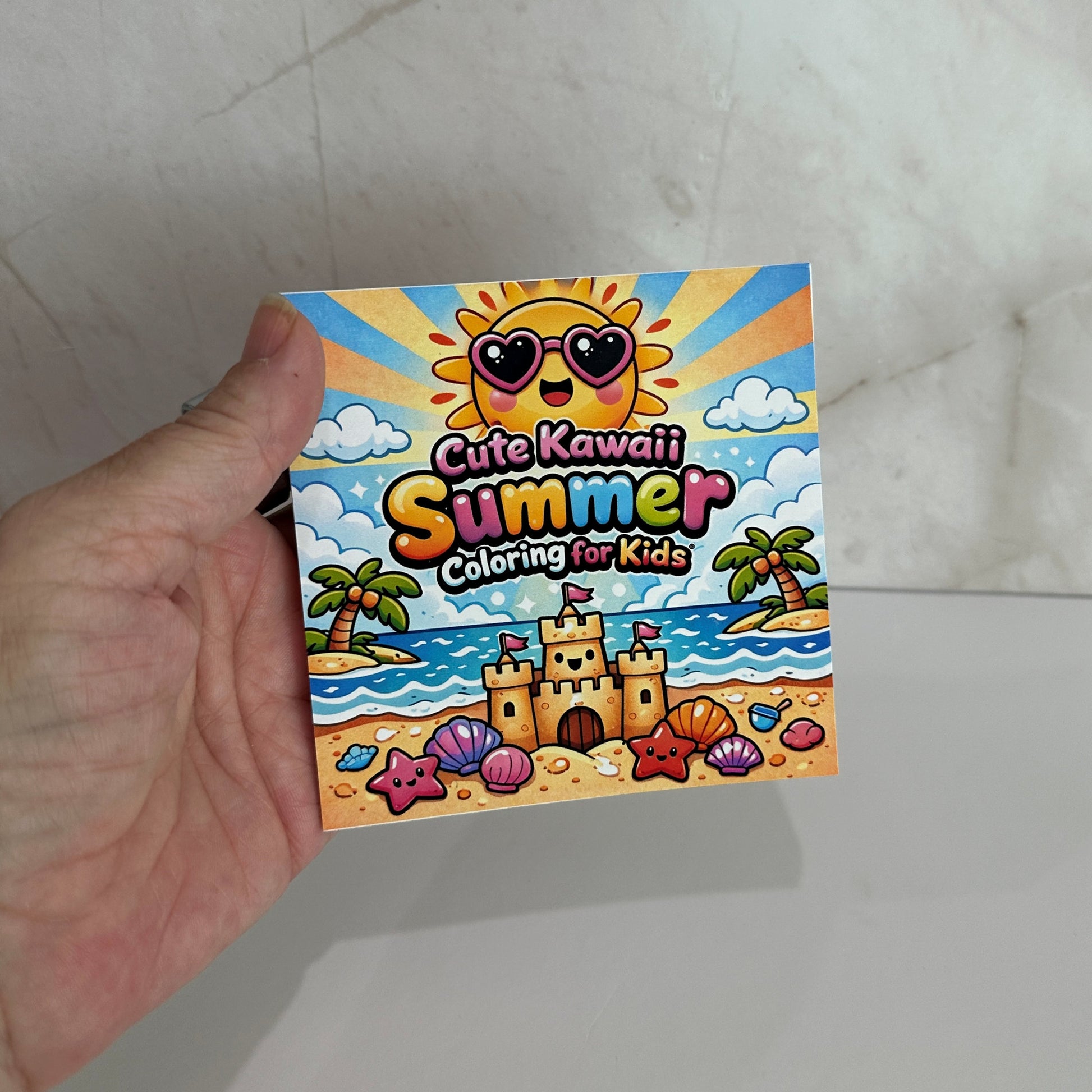 Cute kawaii summer mini coloring book featuring smiling sunshine, sandcastle, palm trees and beach illustrations for kids.