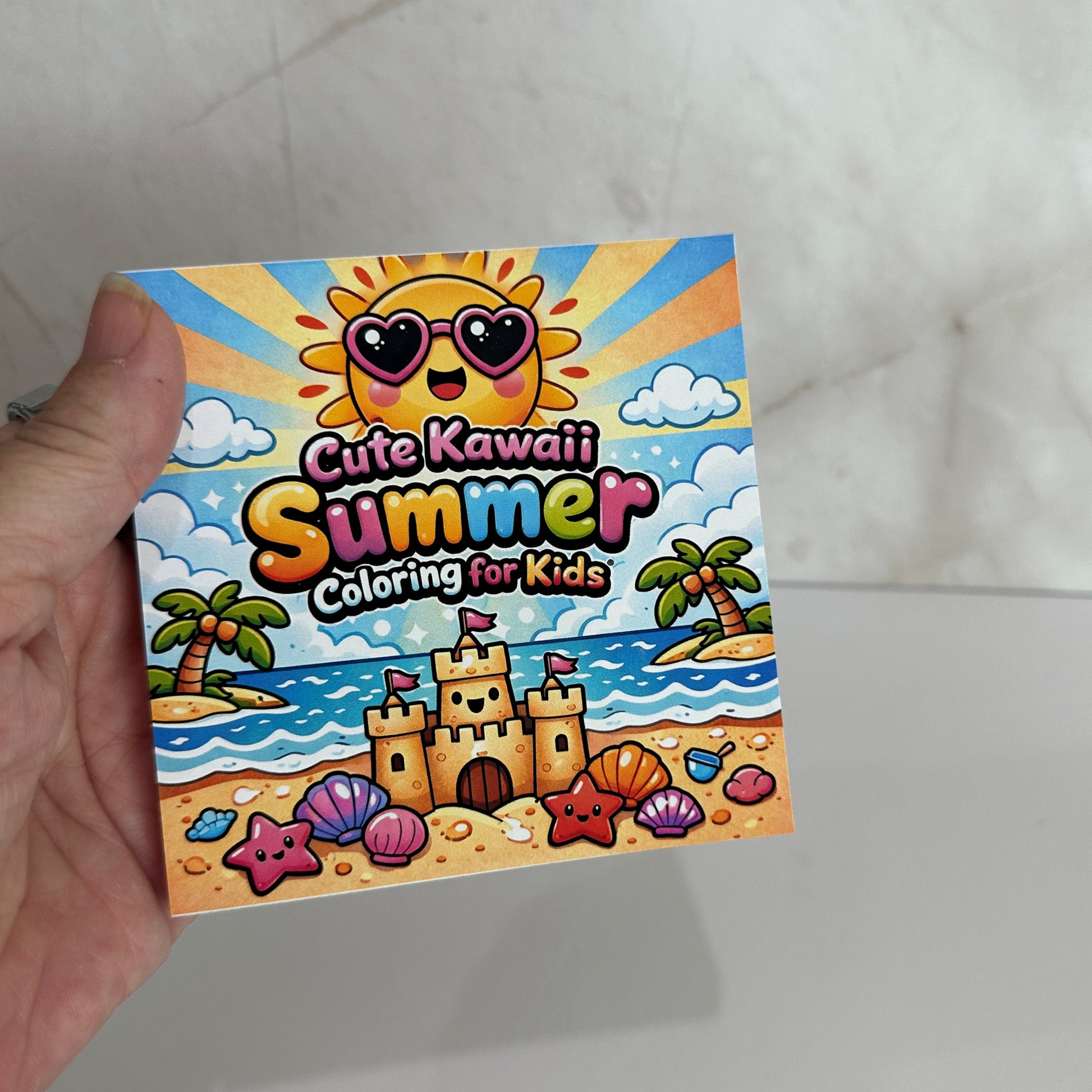Cute kawaii summer mini coloring book featuring smiling sunshine, sandcastle, palm trees and beach illustrations for kids.