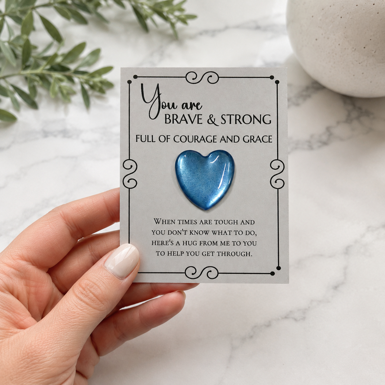 Inspirational pocket hug keepsake with a heart-shaped token on a "You Are Brave & Strong" encouragement card, a thoughtful comfort gift for friends, family, coworkers, or anyone needing support.