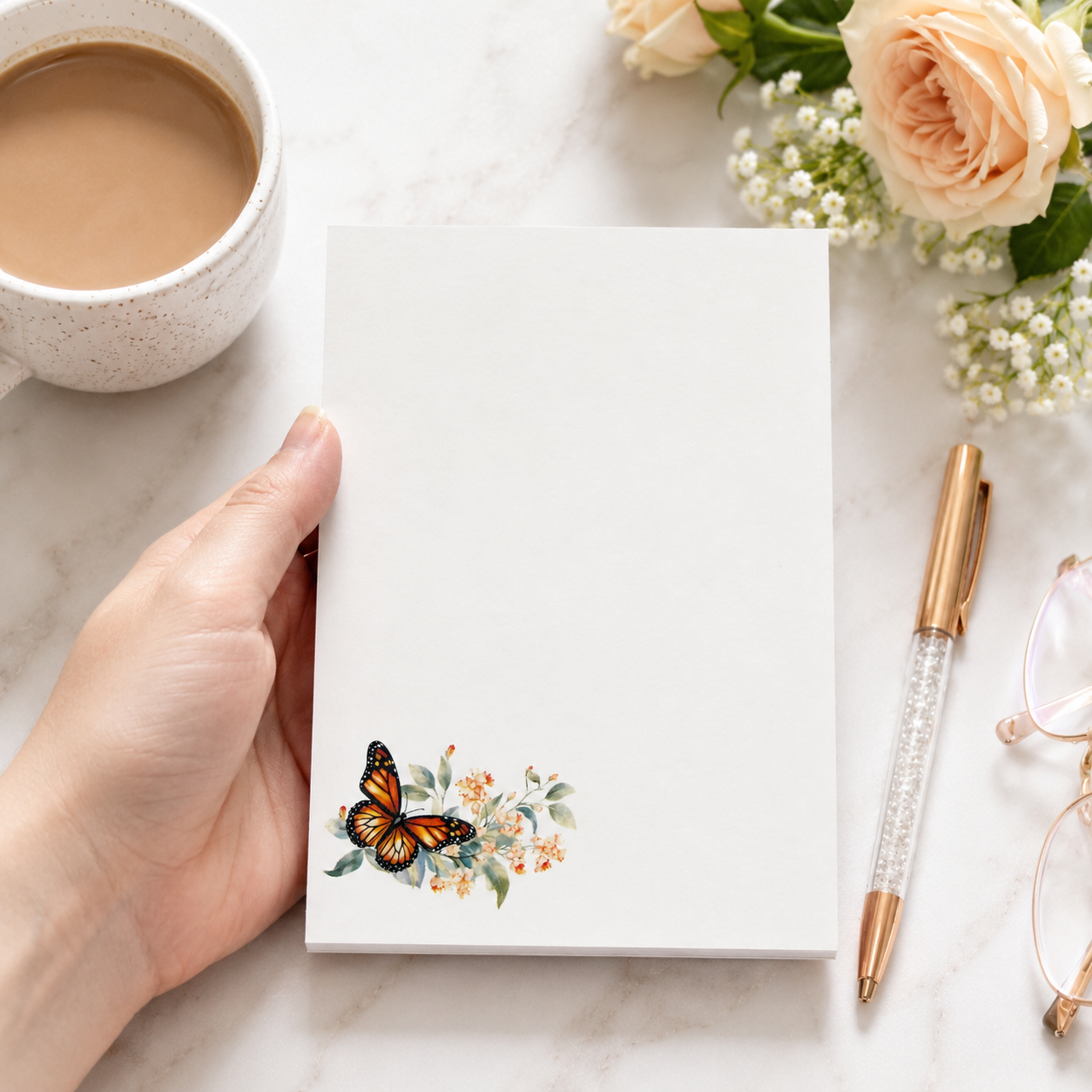 White butterfly floral notepad featuring a monarch butterfly with soft watercolor flowers in the corner and a large blank writing area.