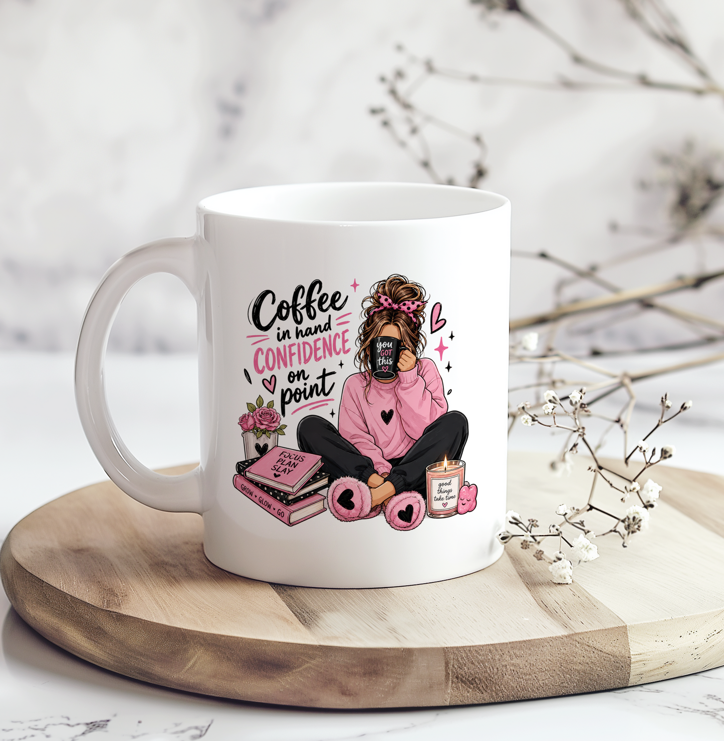 White ceramic motivational coffee mug featuring the phrase "Coffee in Hand, Confidence on Point" with a cozy pink illustration, perfect for coffee lovers, self-care gifts, and inspirational desk décor.