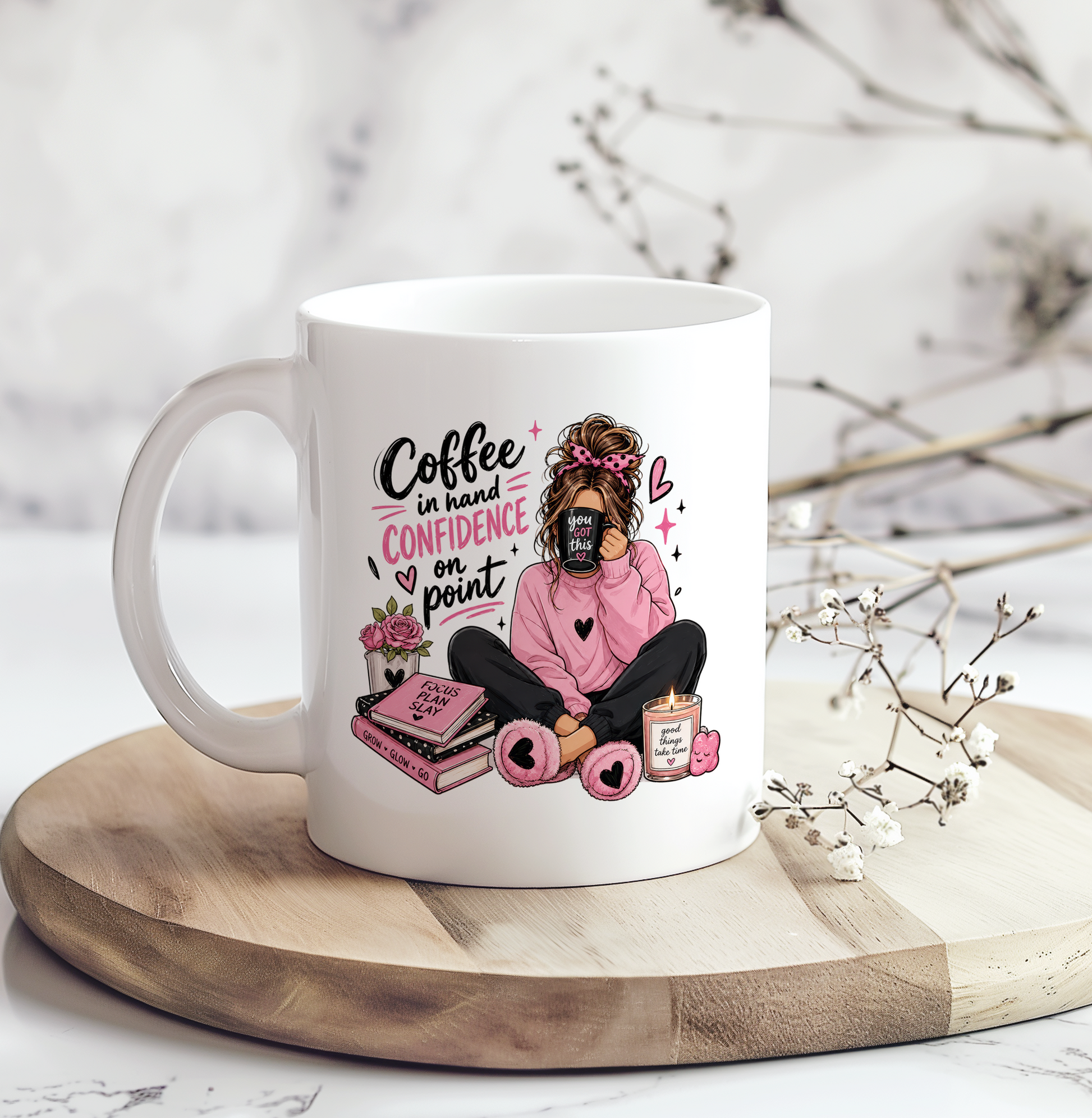White ceramic motivational coffee mug featuring the phrase "Coffee in Hand, Confidence on Point" with a cozy pink illustration, perfect for coffee lovers, self-care gifts, and inspirational desk décor.