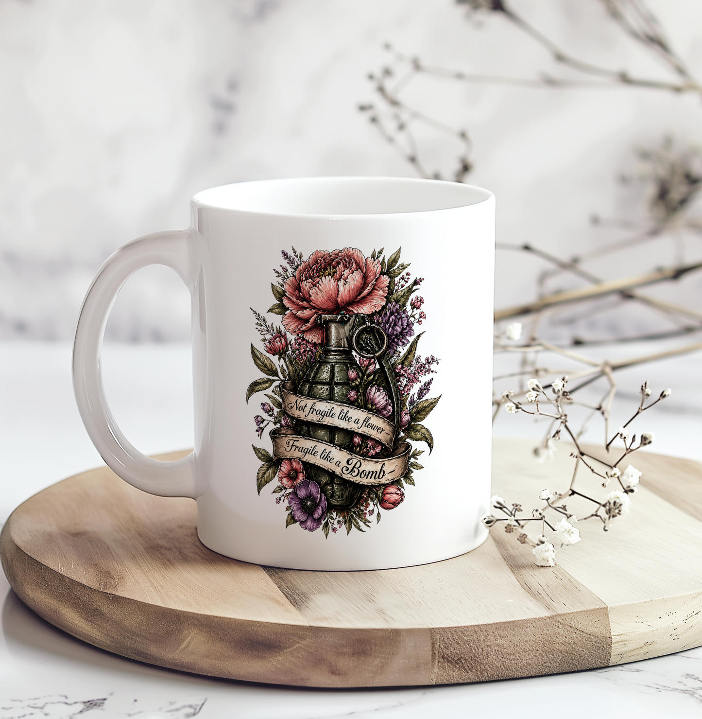 White ceramic coffee mug featuring a vintage floral grenade design with the phrase "Not fragile like a flower, fragile like a bomb," perfect as a funny sarcastic gift mug.