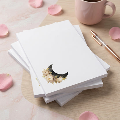 Minimalist floral crescent moon notepad with cream roses and black moon design, celestial stationery memo pad for notes and lists.