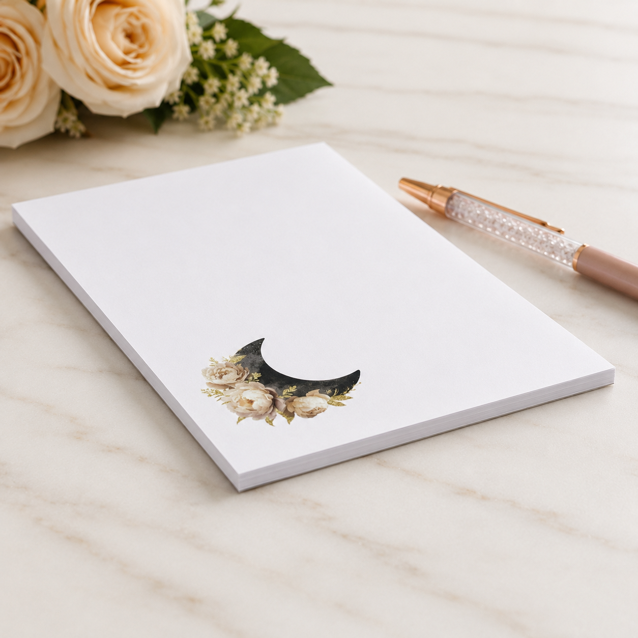 Minimalist floral crescent moon notepad with cream roses and black moon design, celestial stationery memo pad for notes and lists.
