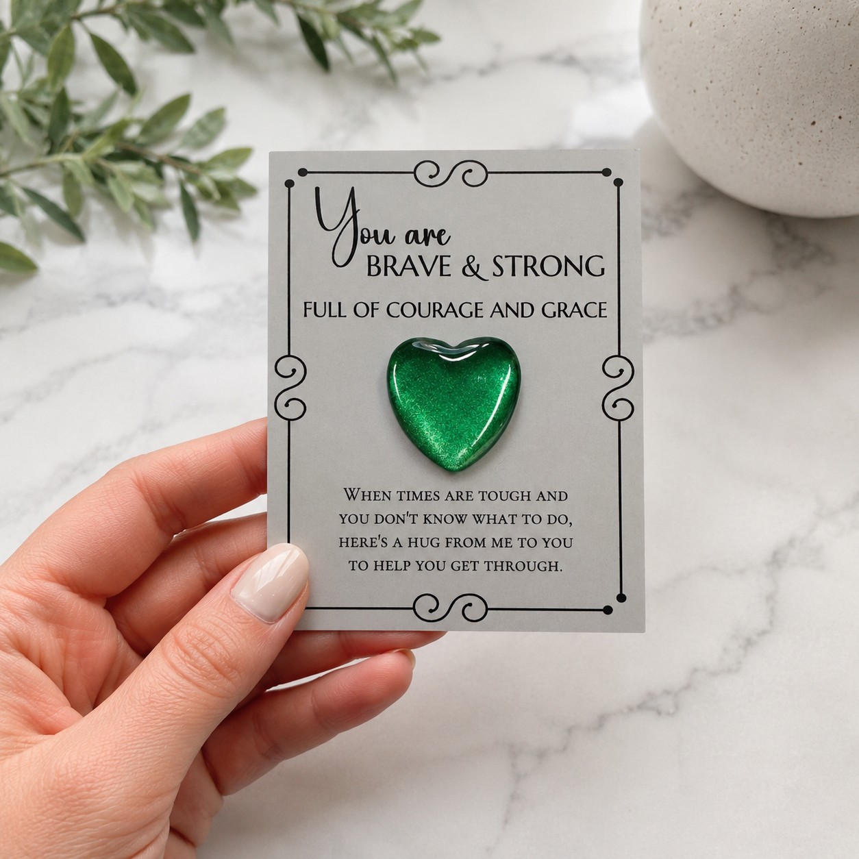 Inspirational pocket hug keepsake with a heart-shaped token on a "You Are Brave & Strong" encouragement card, a thoughtful comfort gift for friends, family, coworkers, or anyone needing support.