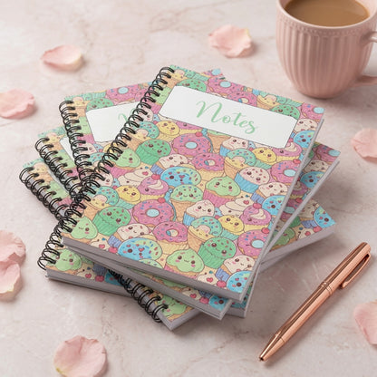 Pastel kawaii dessert spiral notebook featuring cute donuts, cupcakes, ice cream treats, and smiling sweets on a colorful glossy cover.