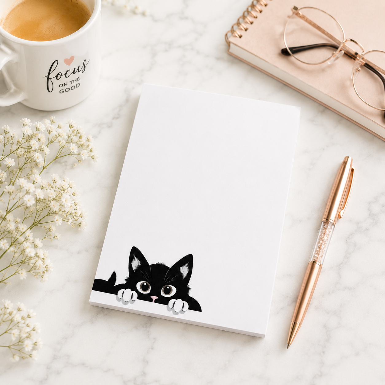 White notepad featuring a cute black kitten peeking from the bottom corner with plenty of blank writing space for notes, lists, and reminders.