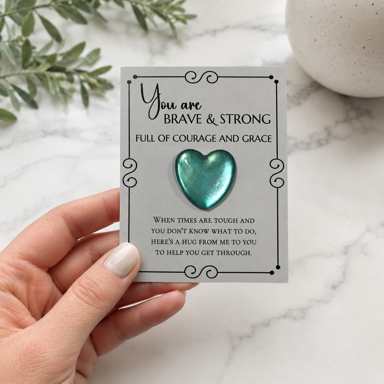 Inspirational pocket hug keepsake with a heart-shaped token on a "You Are Brave & Strong" encouragement card, a thoughtful comfort gift for friends, family, coworkers, or anyone needing support.